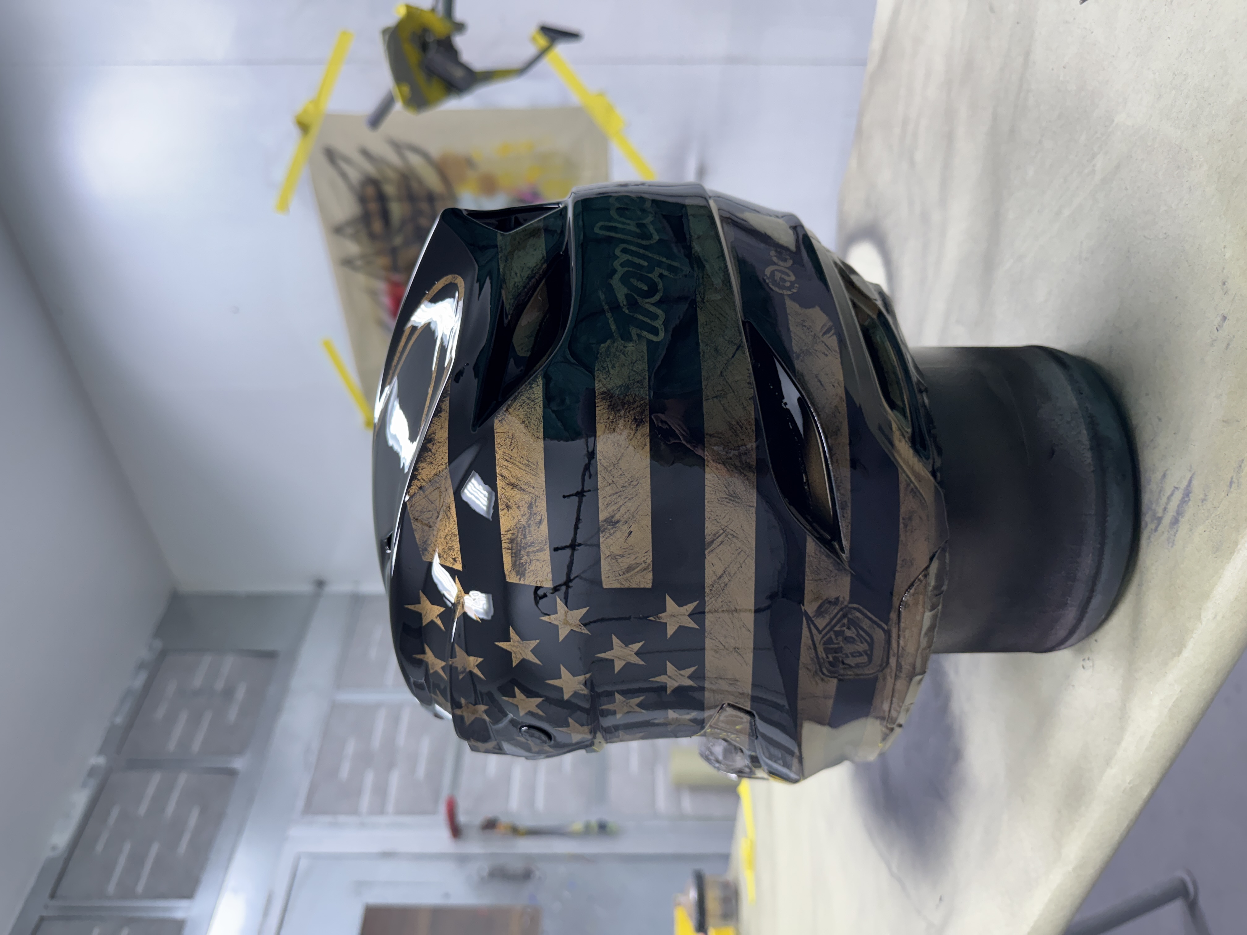 Troy Lee Designs helmet — distressed American flag in black and gold