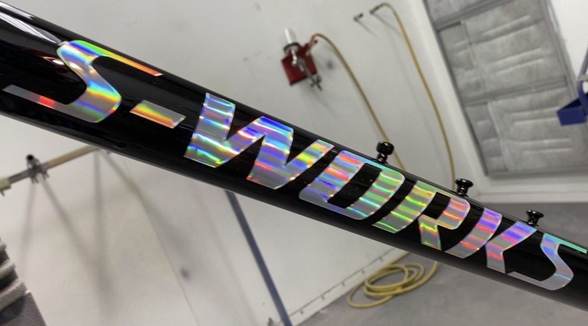 S-Works — holographic rainbow lettering on gloss black